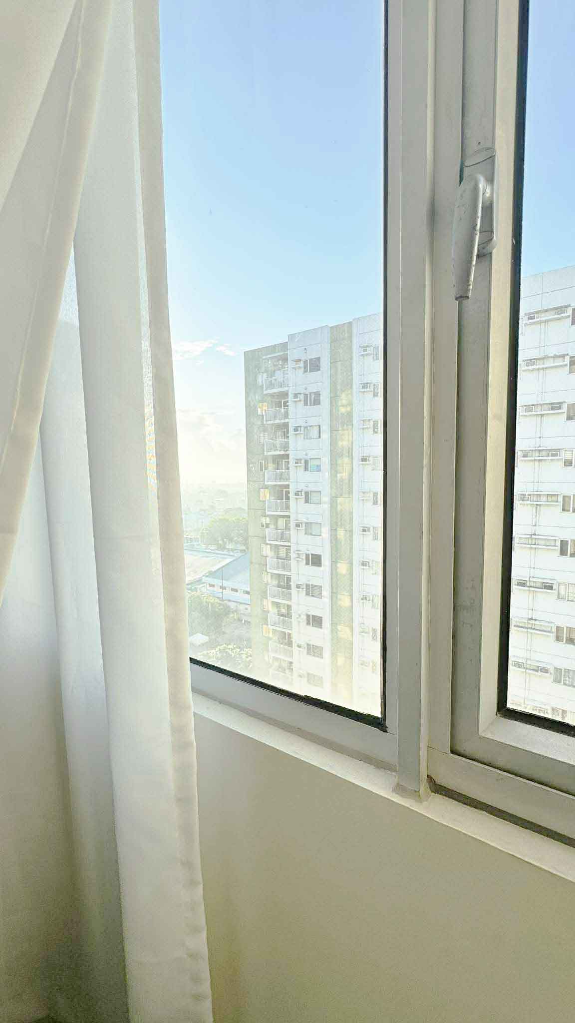 Window view at Avida Towers One Union Place Tower 3, Arca South